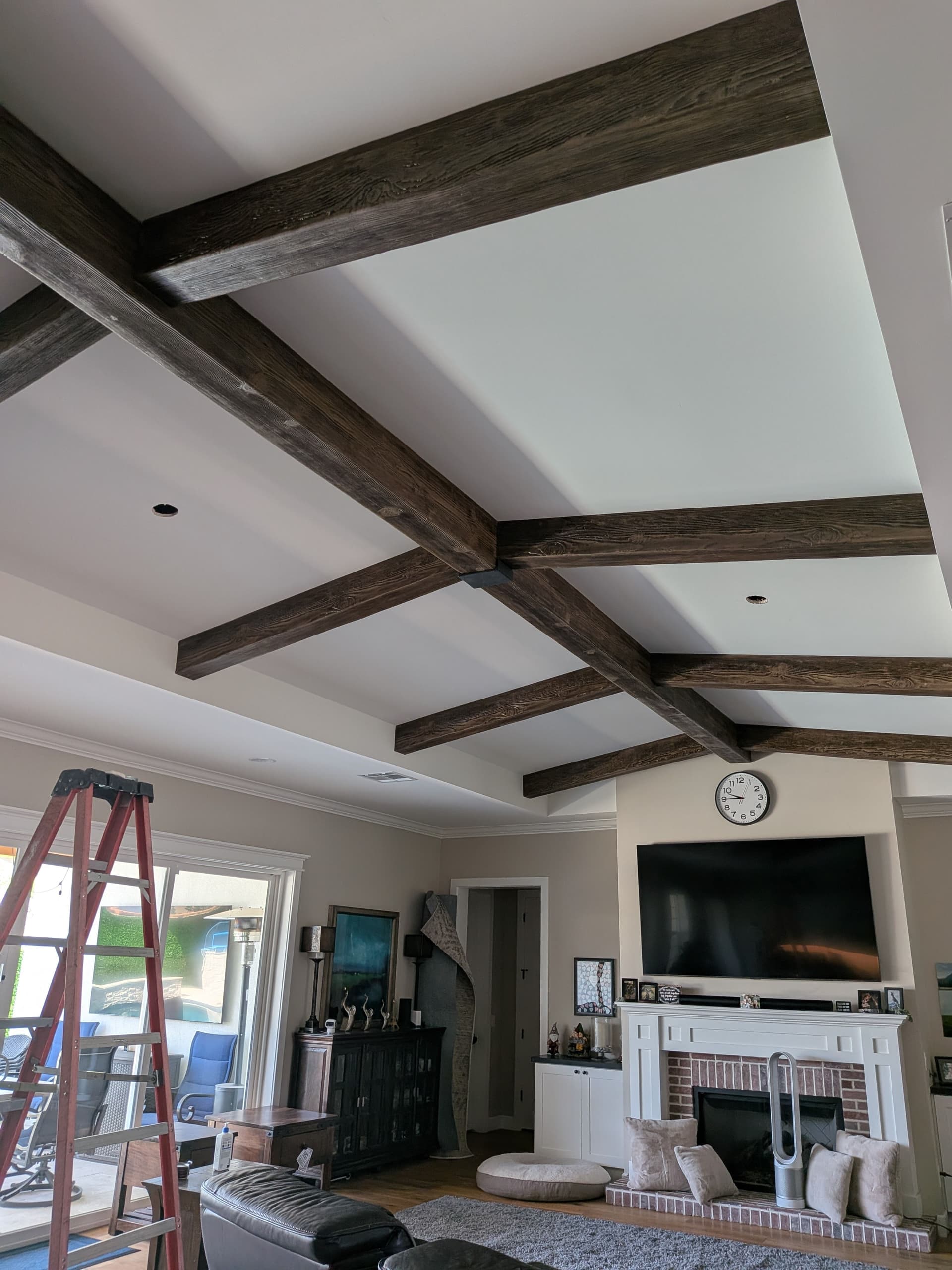 Two Ceiling Fans Added to a Living Room With Exposed Beams image